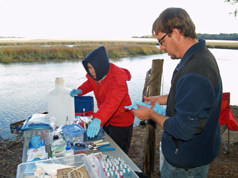 Thais Bittar and Zac Tait begin to process the water sample.