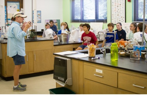 Educator Dodie Sanders discusses microplastics with a class from St. Andrews School. 